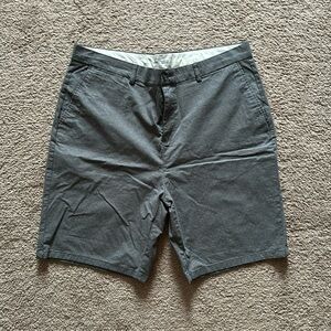 Men’s grey shorts with light polka dots.